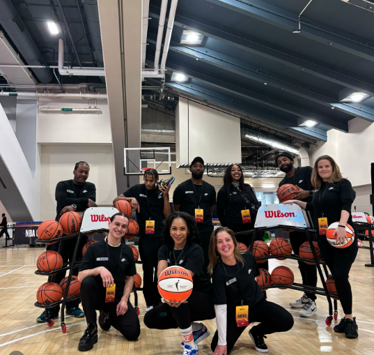 Karma Casting brand ambassadors with Wilson basketballs at a basketball event